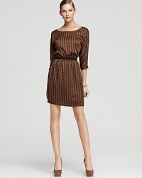 A subtle chain-link print lends luxe appeal to a fluid MICHAEL Michael Kors dress, cinched and belted at the waist for feminine intrigue. A subtle chain-link print lends luxe appeal to a fluid MICHAEL Michael Kors dress, cinched and belted at the waist for feminine intrigue.
