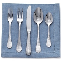 The Continental Hammered set by Wallace includes: 12 five-piece place settings, five hostess pieces, 12 extra teaspoons, and 1 pie server. The Continental Hammered set by Wallace includes: 12 five-piece place settings, five hostess pieces, 12 extra teaspoons, and 1 pie server.