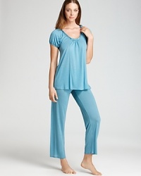 To sleep or to lounge, this versatile cap-sleeve T-shirt and knit pants from Midnight by Carole Hochman are silky soft.