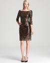 A wide boat neck shows off the collar bone on David Meister's sparkling dress, detailed in thousands of metallic sequins.
