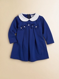 Matching flowers adorn the waist of this sweet, pleated frock with Peter Pan collar.Peter Pan collarLong sleevesBack zipperEmpire waistPleated skirtPolyester/Rayon/SpandexDry cleanImported Matching flowers adorn the waist of this sweet, pleated frock with Peter Pan collar.Peter Pan collarLong sleevesBack zipperEmpire waistPleated skirtPolyester/Rayon/SpandexDry cleanImported