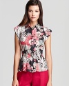 Flaunt vibrant style with this luxe silk Armani Collezioni shirt in a bold, of-the-moment tropical print.