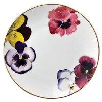 Pensees bread and butter plates by Bernardaud. This lively, luxurious collection is sure to transform your table into a celebration of spring. The floral watercolor pattern features delicate, multicolored pansies that appear to be strewn across the surface of each piece. Pensees bread and butter plates by Bernardaud. This lively, luxurious collection is sure to transform your table into a celebration of spring. The floral watercolor pattern features delicate, multicolored pansies that appear to be strewn across the surface of each piece.