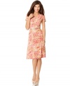 An impressionistic floral print brings a simple silhouette to life in this look from Jones New York.