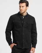 Featuring a classic button-down shirt silhouette, this stand-collar cotton jacket offers laid-back style.Stand collarSnap frontFront pocketsStylish back yokeAbout 28 from shoulder to hemCottonMachine washImported of domestic fabric