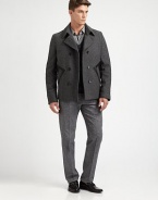 A double-breasted outerwear silhouette crafted in a superior wool blend, featuring leather pocket detailing for a uniquely tailored finish.Button-frontWaist slash pocketsFully linedAbout 27 from shoulder to hem80% wool/20% polyamideDry cleanImported