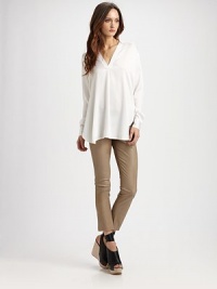 Silk v-neck has dropped shoulders, long bishop sleeves and a length that's perfect for leggings or your favorite skinny jeans. V-neckDropped shouldersLong bishop sleevesLonger length hits below the hips95% silk/5% spandexDry cleanImportedModel shown is 5'11 (180cm) wearing US size Small. Silk v-neck has dropped shoulders, long bishop sleeves and a length that's perfect for leggings or your favorite skinny jeans. V-neckDropped shouldersLong bishop sleevesLonger length hits below the hips95% silk/5% spandexDry cleanImportedModel shown is 5'11 (180cm) wearing US size Small.