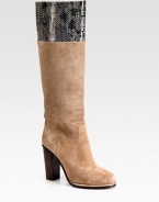 Suede knee-high boot has a contrasting, stacked heel and snake-print leather trim. Stacked heel, 4 (100mm)Shaft, 16Leg circumference, 14Suede and snake-print leather upperPull-on styleLeather liningRubber solePadded insoleImportedOUR FIT MODEL RECOMMENDS ordering one half size up as this style runs small. 