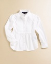 A classic tuxedo shirt is accented with a pintucked bib and pretty ruffles for a girly look.Ruffled stand collarLong sleeves with ruffled-trim barrel cuffsButton-frontPintucked bibCottonMachine washImported Please note: Number of buttons may vary depending on size ordered. 