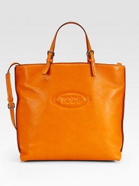 Roomy design with the iconic logo, crafted in luxe leather for on-the-go style. Adjustable top handles, 3¾-9½ dropAdjustable shoulder strap, 17-20 dropMagnetic snap closureOne inside zip pocketFully lined14½W X 13H X 5DMade in Italy