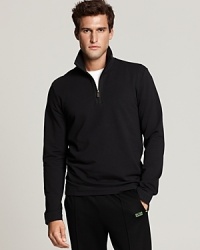 Long sleeve, French terry half zip with mockneck stand collar. Logo patch at bottom hem. Long sleeve, French terry half zip with mockneck stand collar. Logo patch at bottom hem.