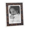 Accent your photographs with a nature-inspired frame from Reed & Barton, inlaid with faux tortoise and banded with tarnish-resistant silver-plate for an attractive display at home or the office.