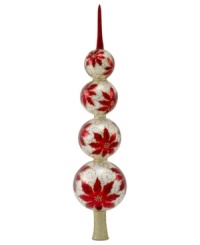 At over a foot tall, this impressive finial provides a stunning top to any tree. Four stacked ball ornaments hand painted with red poinsettias and dots of shimmering gold are a sight to behold every Christmas. At over a foot tall, this impressive finial provides a stunning top to any tree. Four stacked ball ornaments hand painted with red poinsettias and dots of shimmering gold are a sight to behold every Christmas.