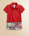 Sure to be a go-to essential, this timeless set pairs a classic cotton jersey polo with a preppy patchwork short and grosgrain belt. Shirt Pointed collarShort sleevesButton-frontEven vented hem Shorts Button closureRear elasticized waistband with belt loopsSewn flySide slant pocketsButtoned back welt pocketCottonMachine washImported Please note: Number of buttons may vary depending on size ordered. 