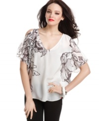 Shoulder cutouts offer the world a peek of skin, while light-as-a-feather silk creates a billowy silhouette on this femme and sophisticated top from GUESS?. Shoulder cutouts offer the world a peek of skin, while light-as-a-feather silk creates a billowy silhouette on this femme and sophisticated top from GUESS?.