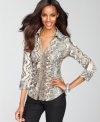 Shimmering snakeskin print emboldens INC's ruched shirt. Rhinestone buttons provide a touch of extra sparkle.