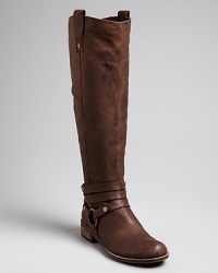 STEVEN BY STEVE MADDEN gets harness-happy with triple strap details at each ankle of this tall pair of boots. Slightly Western touches keep them right in step with the season. STEVEN BY STEVE MADDEN gets harness-happy with triple strap details at each ankle of this tall pair of boots. Slightly Western touches keep them right in step with the season.