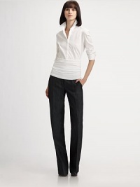 This long sleeve blouse features a crisp tailored top and cummerbund waist giving it a sporty yet chic feel.Shirt collarLong sleeves with button cuffsConcealed button frontFront pleatsRuched bottom panelConcealed side zip74% cotton/21% polyamide/5% elastaneImported of Swiss fabricDry cleanModel shown is 5'9 (175cm) wearing US size 4. This long sleeve blouse features a crisp tailored top and cummerbund waist giving it a sporty yet chic feel.Shirt collarLong sleeves with button cuffsConcealed button frontFront pleatsRuched bottom panelConcealed side zip74% cotton/21% polyamide/5% elastaneImported of Swiss fabricDry cleanModel shown is 5'9 (175cm) wearing US size 4.