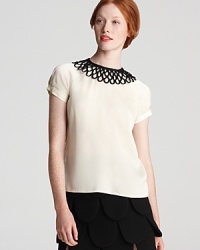 An elegant piped neckline gives this Milly shirt ladylike appeal while a back button placket adds to its true femininity. An elegant piped neckline gives this Milly shirt ladylike appeal while a back button placket adds to its true femininity.