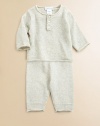 A luxurious set for baby features an adorable sweater and matching pant rendered in sumptuous cotton knit for style and comfort. Cardigan Rolled neckLong sleeves with rolled cuffsButton-front Pants Elastic waistband with drawstring bowRolled hemCottonDry cleanImported Please note: number of buttons may vary depending on size ordered. 