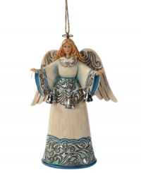 The angel we have heard on high. Set in striking blue & shimmery hues, this welcoming angel exudes a sense of peace and calm, as she stretches her arms forward and showcases a string of glistening silver bells. The angel we have heard on high. Set in striking blue & shimmery hues, this welcoming angel exudes a sense of peace and calm, as she stretches her arms forward and showcases a string of glistening silver bells.