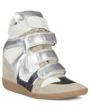 So completely trendy and cute. Steve Madden's Hilight wedge sneakers feature a thick tongue and three fat contrasting Velcro straps across the vamp.