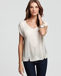 Woven from lustrous silk georgette, this airy-light Joie top is embellished with a beading and embroidery with edgy vent details on front and back--slip on your favorite skinnies for the ultimatefall duo. Woven from lustrous silk georgette, this airy-light Joie top is embellished with a beading and embroidery with edgy vent details on front and back--slip on your favorite skinnies for the ultimatefall duo.