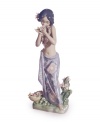 Hawaii beckons. A young hula dancer stops to smell the orchids in this fanciful collectible, handcrafted in exquisite Lladro porcelain.