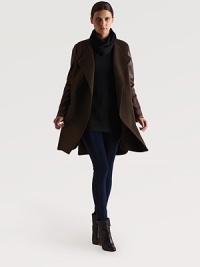 A distinctive wool overcoat styled with rich leather sleeves for a touch of urban chic.Snap-button closureFlat frontShirttail hemAbout 35 from shoulder to hemBody: 90% wool/10% nylonSleeves: lambskinDry clean by a leather specialistImportedModel shown is 5'9 (175cm) wearing US size Small. A distinctive wool overcoat styled with rich leather sleeves for a touch of urban chic.Snap-button closureFlat frontShirttail hemAbout 35 from shoulder to hemBody: 90% wool/10% nylonSleeves: lambskinDry clean by a leather specialistImportedModel shown is 5'9 (175cm) wearing US size Small.