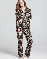 Dream of safaris and exotic lands in Betsey Johnson's flannel pajama set with contrast bow details. Dream of safaris and exotic lands in Betsey Johnson's flannel pajama set with contrast bow details.