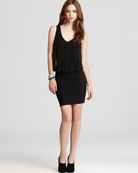 Poised to party, this little black GUESS dress boasts tonal bead details on a sheer blouson top that rests atop a flattering fitted skirt. Poised to party, this little black GUESS dress boasts tonal bead details on a sheer blouson top that rests atop a flattering fitted skirt.