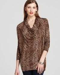 Crisp cheetah print emboldens a decadently draped MICHAEL Michael Kors top for an elegant approach to exotics. Crisp cheetah print emboldens a decadently draped MICHAEL Michael Kors top for an elegant approach to exotics.