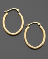 Get a classic look with a stylish edge with these unique flattened oval hoops crafted in 14k gold. Approximate diameter: 1/2 inch. Approximate drop: 1 inch.