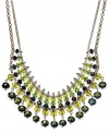 A pretty palette of green ombre glass beads (3-10 mm) decorate this chic frontal necklace from c.A.K.e. by Ali Khan. Crafted in gold tone mixed metal. Approximate length: 14 inches + 3-inch extender. Approximate drop: 1-1/2 inches.