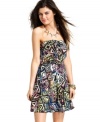 Material Girl accents a lively, tribal print with tough studs on a strapless sundress that turns-up the technicolor!