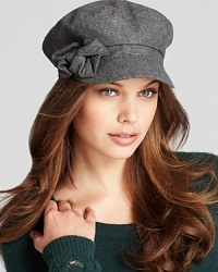 Not quite borrowed from the boys, August Accessories' conductor-style hat is adorned with a scrunchy side bow. Not quite borrowed from the boys, August Accessories' conductor-style hat is adorned with a scrunchy side bow.