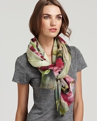 Bindya's luxurious cashmere and silk scarf features an elegant floral print in earthy tones. Bindya's luxurious cashmere and silk scarf features an elegant floral print in earthy tones.