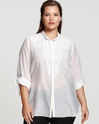 Intricate tonal embroidery covers the front of this effortlessly chic tunic from Tahari Woman. Pair with white trousers for a dramatic head-to-toe finish. Intricate tonal embroidery covers the front of this effortlessly chic tunic from Tahari Woman. Pair with white trousers for a dramatic head-to-toe finish.