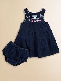 The look of denim in soft, stretch French terry with delicate scalloped trim and sweet embroidered flowers.U-shaped necklineButton strapsScalloped edgingFloral embroidered yokeTiered, flared bodyMatching panty with elasticized waist and leg openings96% cotton/4% spandexMachine washImported