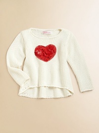 A cute, cozy knit gets a lovely update with a bold heart appliqué.Round necklineLong sleevesPullover styleHi-lo hemRayon/CottonHand washImported