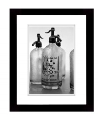 Fitting for the kitchen or bar, this retro-cool wall art depicts vintage seltzer bottles in black and white. Matted and framed in black wood for sophisticated polish from Lauren by Ralph Lauren. Fitting for the kitchen or bar, this retro-cool wall art depicts vintage seltzer bottles in black and white. Matted and framed in black wood for sophisticated polish from Lauren by Ralph Lauren.