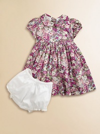 A brilliant floral print adds style and substance to this warm-weather ready frock with Peter Pan collar and back buttons for easy on and off.Peter Pan collarShort puff sleevesBack buttonsWaistband with back tieGathered skirtMachine washCottonMachine washImported Please note: Number of buttons may vary depending on size ordered. A brilliant floral print adds style and substance to this warm-weather ready frock with Peter Pan collar and back buttons for easy on and off.Peter Pan collarShort puff sleevesBack buttonsWaistband with back tieGathered skirtMachine washCottonMachine washImported Please note: Number of buttons may vary depending on size ordered.