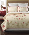 A smattering of fanciful florals and leaves sits upon a landscape of quilted beauty in this Cabin Flowers quilt from Martha Stewart Collection. A touch of classic red offers a charming touch.
