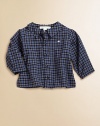 A not-so-basic cotton button-down is ultra-handsome in a snazzy plaid print.Point collarLong sleeves with button cuffsButton-frontCottonMachine washImported Please note: Number of buttons may vary depending on size ordered. 