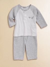From the Nutkins collection, a striped pima cotton Henley is adorned with embroidered squirrels and paired with a matching pair of footed pants for a precious ensemble. Top CrewneckLong raglan sleeves Front snaps Pants Elastic waistbandBack patch pocket94% pima cotton/6% polyesterMachine washImported Please note: Number of snaps may vary depending on size ordered. From the Nutkins collection, a striped pima cotton Henley is adorned with embroidered squirrels and paired with a matching pair of footed pants for a precious ensemble. Top CrewneckLong raglan sleeves Front snaps Pants Elastic waistbandBack patch pocket94% pima cotton/6% polyesterMachine washImported Please note: Number of snaps may vary depending on size ordered.
