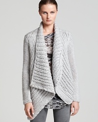 Master the cozy-chic trend in a chunky Helmut Lang cardigan, perfect for cool days when draped over a printed tee with your skinniest jeans. Master the cozy-chic trend in a chunky Helmut Lang cardigan, perfect for cool days when draped over a printed tee with your skinniest jeans.