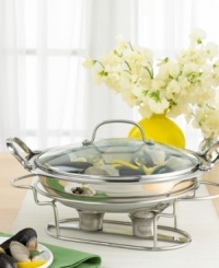 Serve up delicious food and warm hospitality with Cuisinart's elegant 11 buffet server. This all-purpose, stainless piece saves you the hassle of washing a multitude of pots and pans - it goes straight from the stovetop or oven right to the serving table. Two tea light candles placed in the warming stand are all it takes to keep your food fresh and at the perfect serving temperature for hours. A clear glass lid locks in heat while proudly displaying your culinary masterpiece. Limited lifetime warranty. Serve up delicious food and warm hospitality with Cuisinart's elegant 11 buffet server. This all-purpose, stainless piece saves you the hassle of washing a multitude of pots and pans - it goes straight from the stovetop or oven right to the serving table. Two tea light candles placed in the warming stand are all it takes to keep your food fresh and at the perfect serving temperature for hours. A clear glass lid locks in heat while proudly displaying your culinary masterpiece. Limited lifetime warranty.