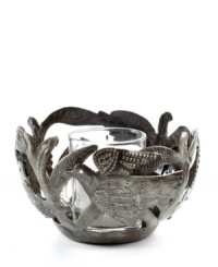 Hand cut and hammered by artist Michaelson, the Fire Bird votive holder accompanies flickering candlelight with intricate birds and branches. Steel from recycled barrels gives each one-of-a-kind piece a rustic beauty perfected by Haiti's esteemed artisans. Hand cut and hammered by artist Michaelson, the Fire Bird votive holder accompanies flickering candlelight with intricate birds and branches. Steel from recycled barrels gives each one-of-a-kind piece a rustic beauty perfected by Haiti's esteemed artisans.