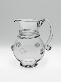 Old-world style and a fluid, mouthblown shape define the elegant design of a small pitcher ideal for any occasion. 19-ounce capacity 6 high Hand wash Imported