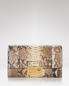 Exotically textured and sized-right for night. Take this season's textured trend out for the night with this luxurious python leather clutch from Michael Kors.